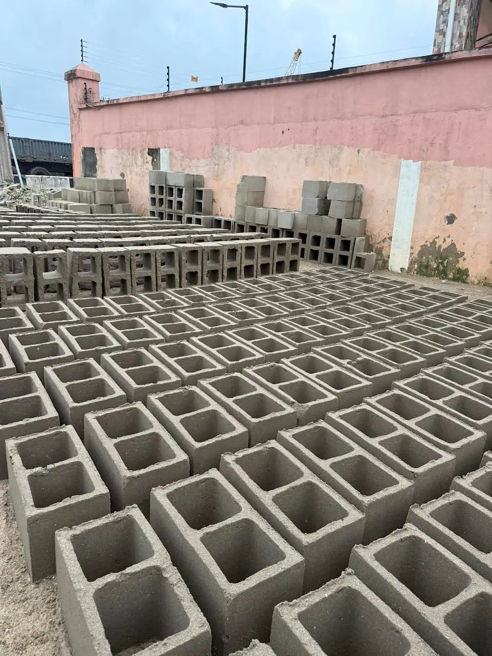 Hundreds of hollow blocks curing in rows at the Naydo Keystone yard in Satellite Town Lagos
