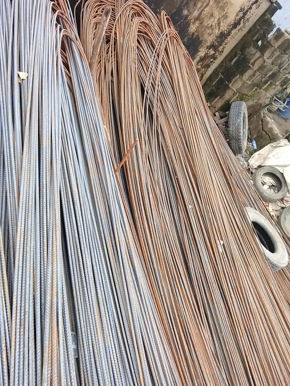 Reinforcement steel rods stacked upright and ready for collection